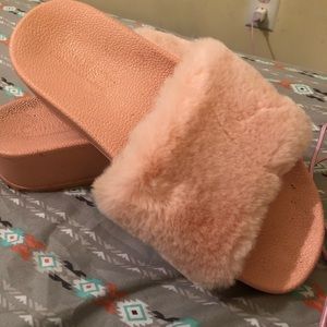 Pink furry platform slip ons